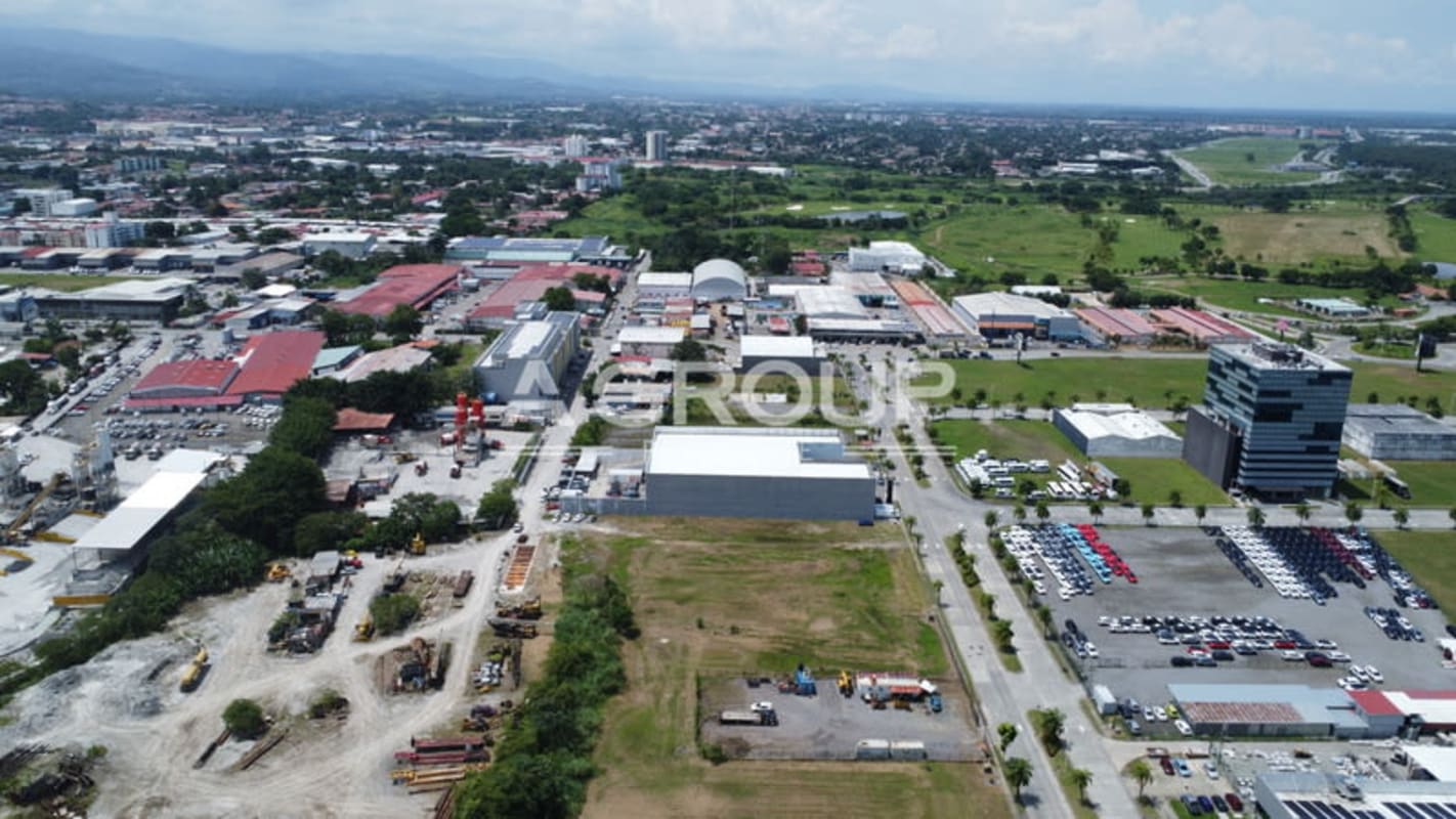 Aerial with commercial warehouses, offices, parking in Santa María District Panama