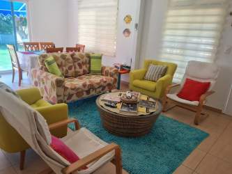 Bright bedroom with window blinds tiled floor in Punta Chame holiday house