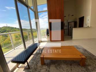 Dining and living room space with balcony access, scenic views, modern tile flooring in PH Mosaic