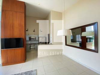 Large covered balcony with lush green views and mountain backdrop in PH Mosaic Panama Pacifico