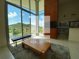 Master bedroom with built-in closets floor-to-ceiling window overlooking greenery in PH Mosaic Panama Pacifico
