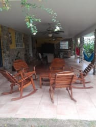Covered patio with hammocks and garden at Costa Esmeralda San Carlos beach house Panama