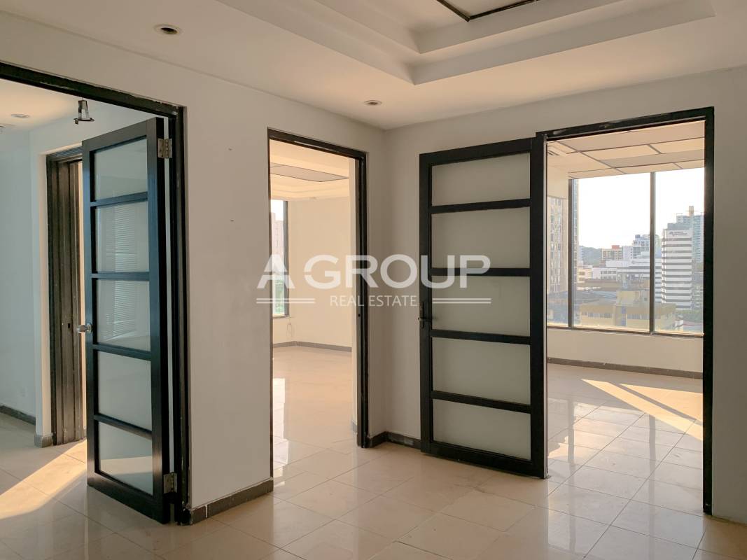 Contemporary commercial office with glass doors and city skyline views in Obarrio Panama