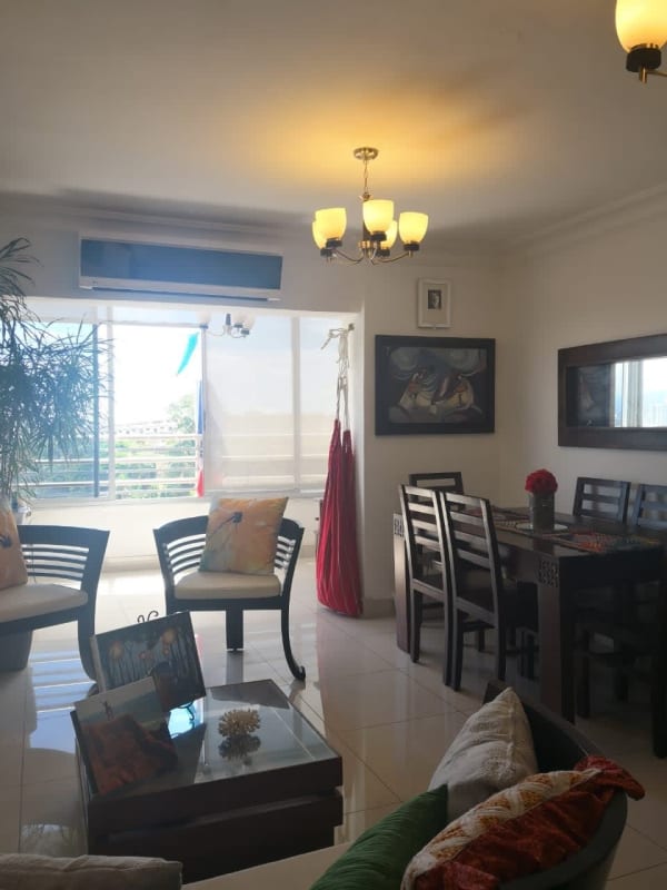 Open bright living and dining area with access to balcony in PH Villa de las Fuentes Panama City