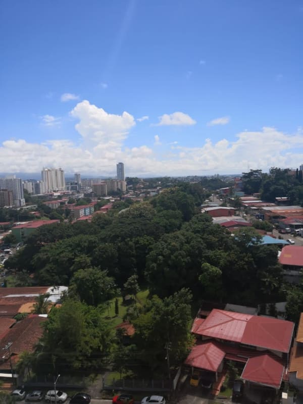 Aerial view over Villa de las Fuentes neighborhood and Panama skyline