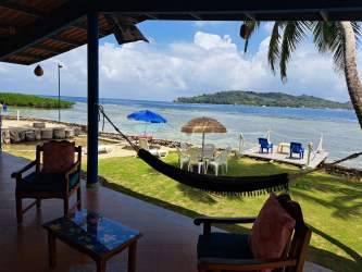 Private deck area with sea access and kayak dock in Juan Gallego beachfront rental Colon