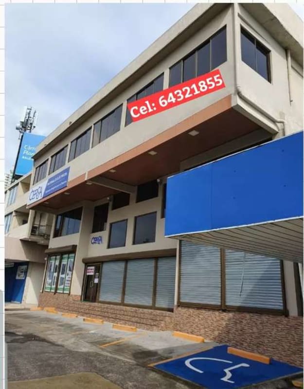Modern commercial plaza with handicap parking, large windows, and signage in San Miguelito Panama