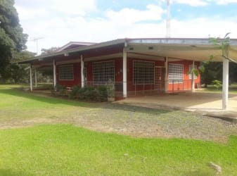 Country home wrap-around porch with mature garden Calobre Veraguas Panama