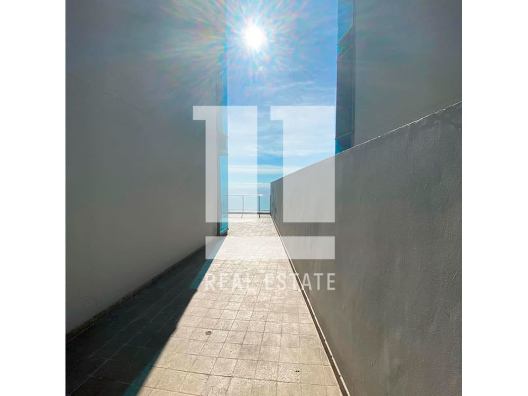 Spacious living room with city views, large windows, and modern design in Pacific Village Punta Pacifica