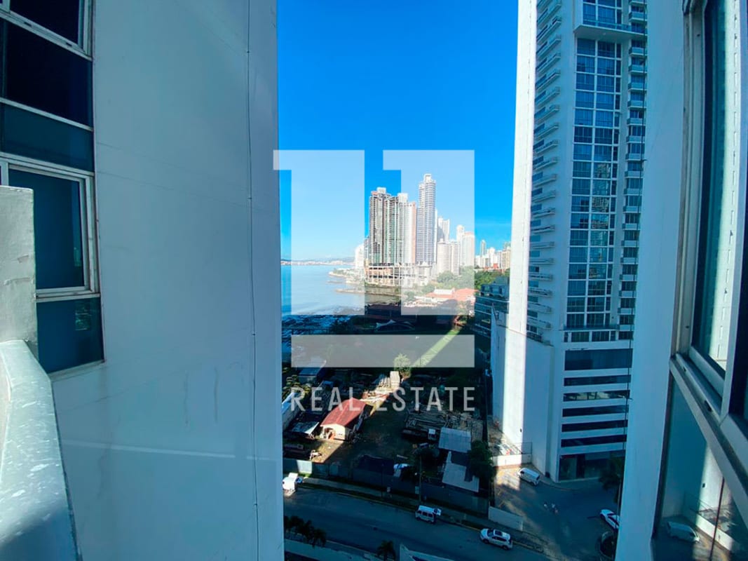 Bathroom with blue designer tile, glass shower, and modern fixtures in Pacific Village Panama