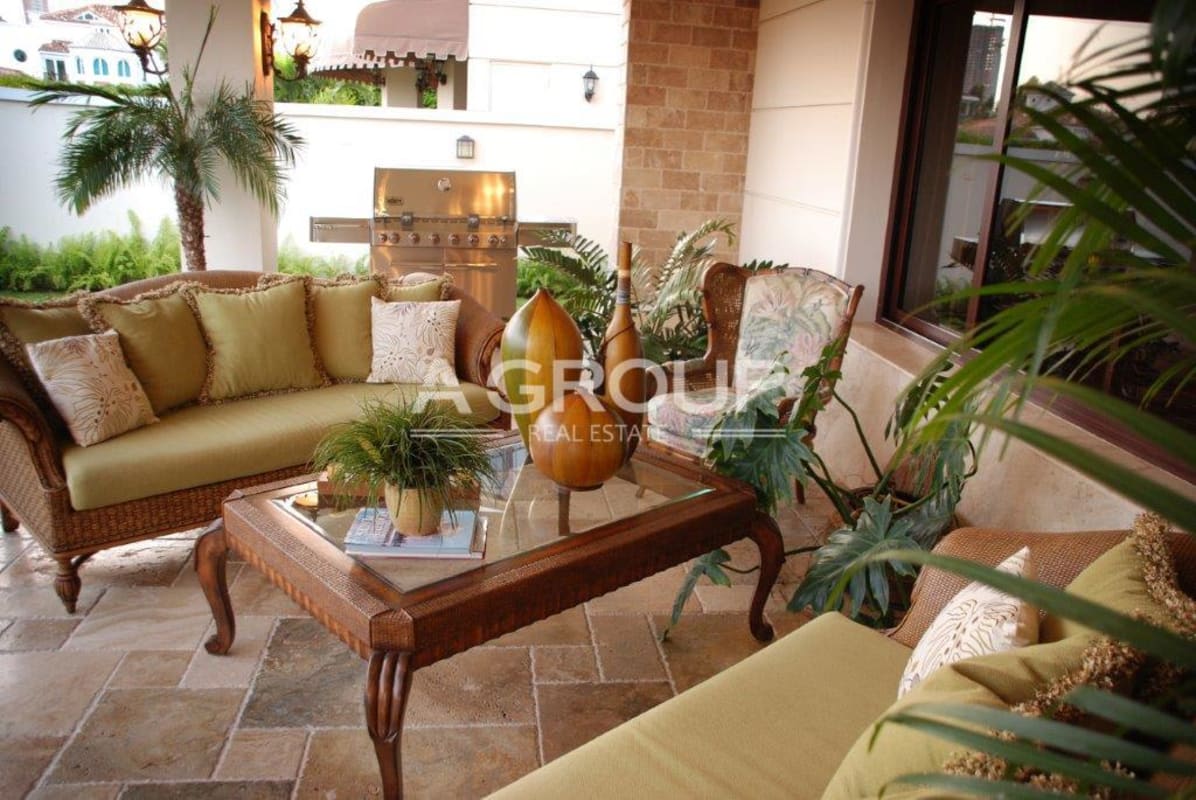 Luxury outdoor patio with seating area plants and grill Costa del Este Panama