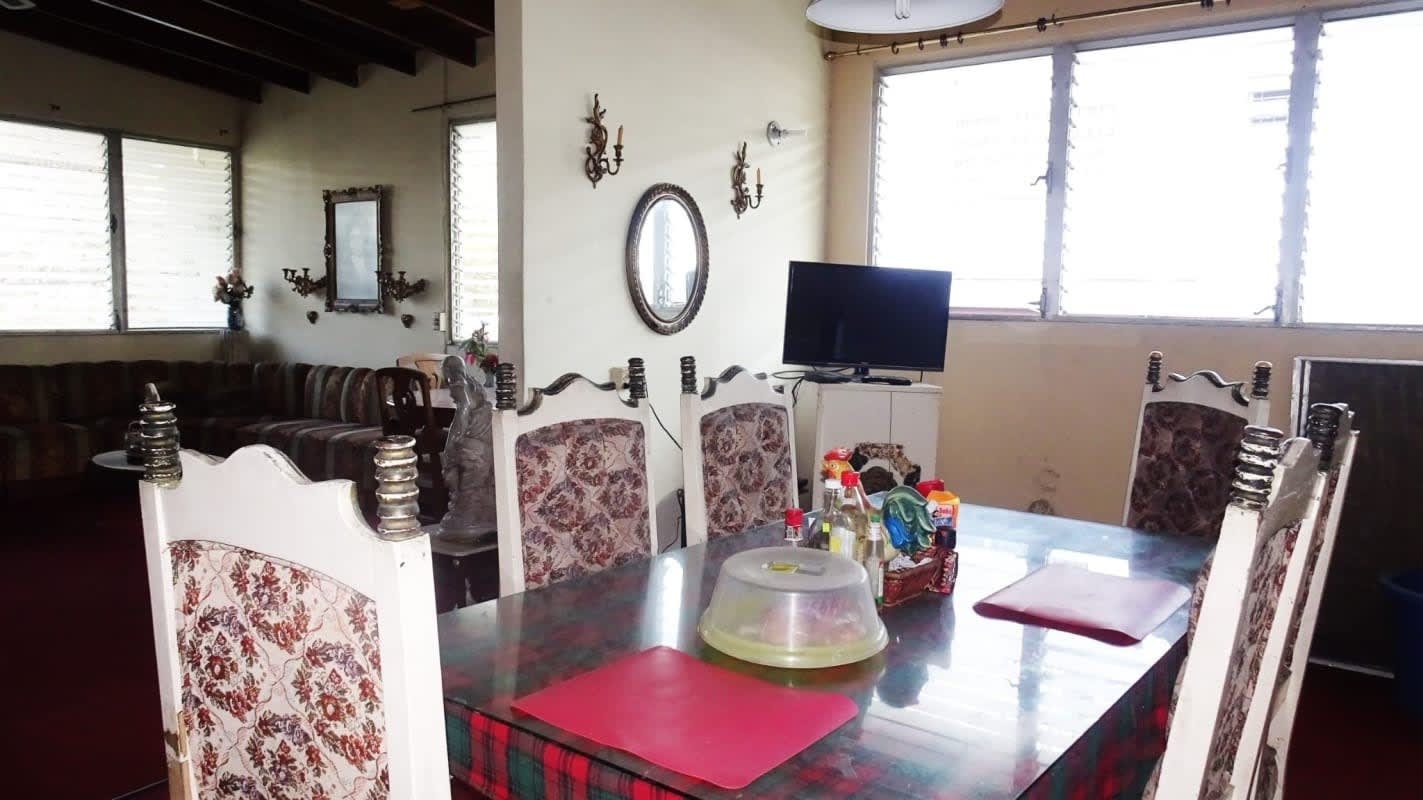 Front garden and yard area with trees and building for sale Panama