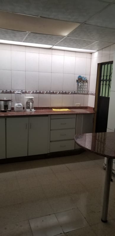 Kitchen with granite countertop, tile backsplash Villa de las Fuentes Panama