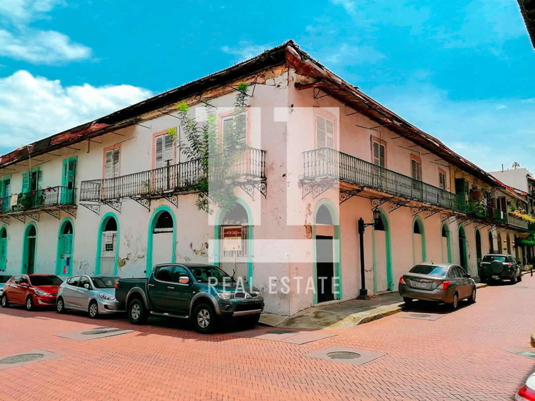 Colonial style two-story building with iron balconies and arched windows Panama City