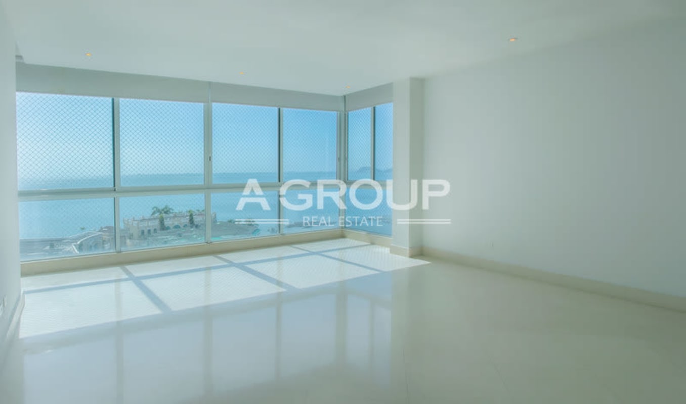 Spacious luxury apartment open space with floor-to-ceiling oceanfront glass windows The Point Punta Paitilla