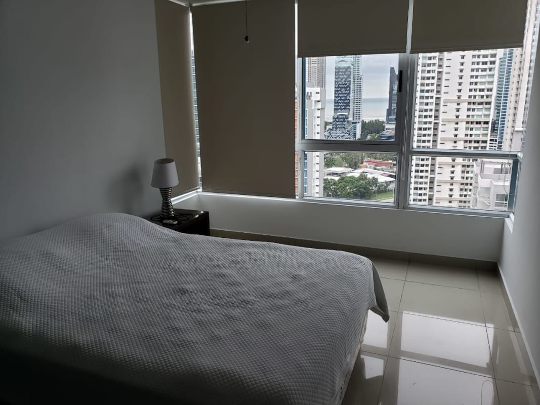 Bedroom with large window city skyline view PH Top Towers Costa del Este Panama City