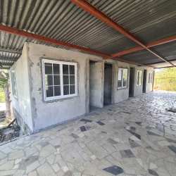 Bedroom with bunk bed, queen bed and AC at Nueva Gorgona beach home Panama