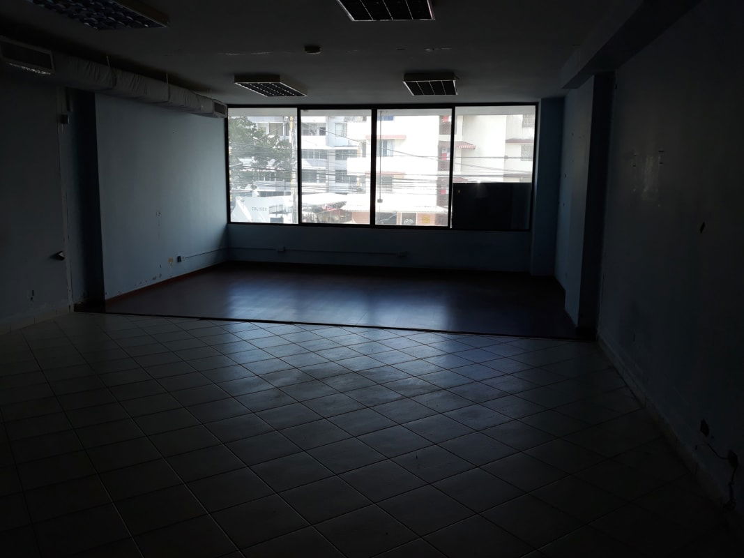 Empty office with large windows bright light tiled floors and ceiling lights PH Royal Park