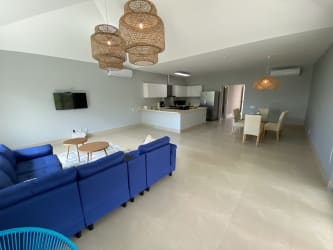 Open kitchen with granite counters and full appliances inside luxury condo Casamar San Carlos