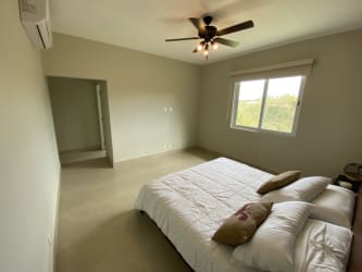 Covered terrace balcony featuring ceiling fan and ocean views at Casamar Panama