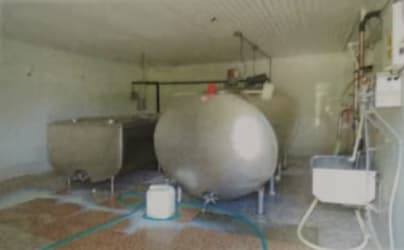 Interior processing area with large milk storage tanks dairy cattle farm Panama