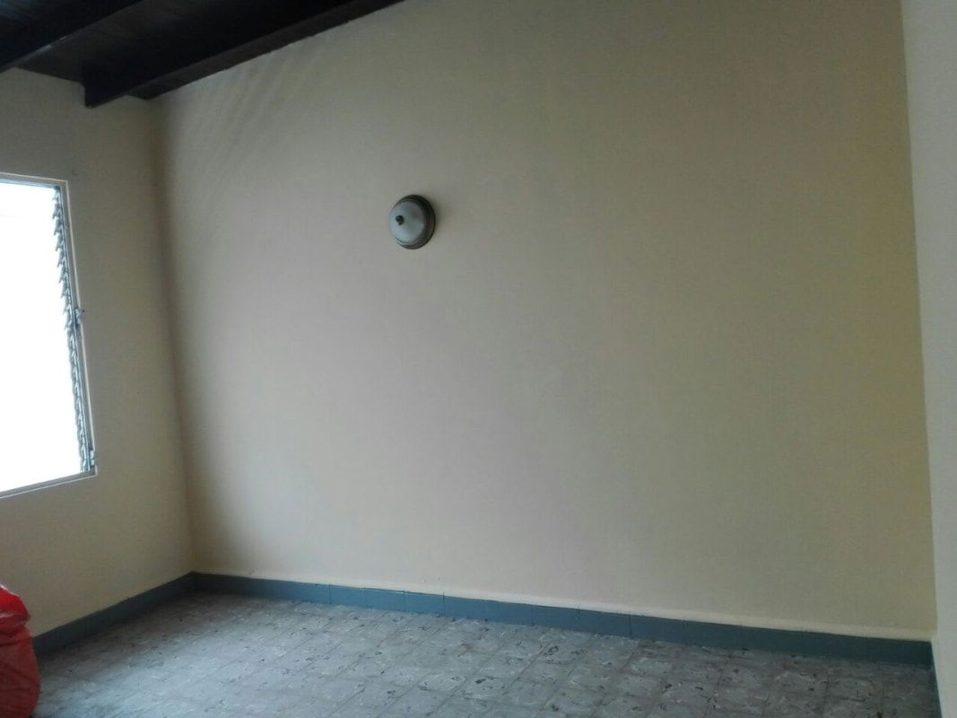 Minimalist empty room with window, tile floor at apartment in Edificio 15 Pueblo Nuevo