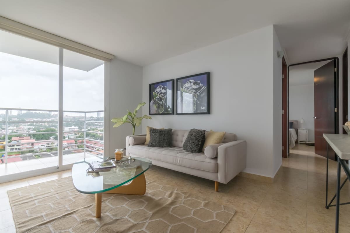 Living room with balcony access at Cosmopolitan Towers Panama City