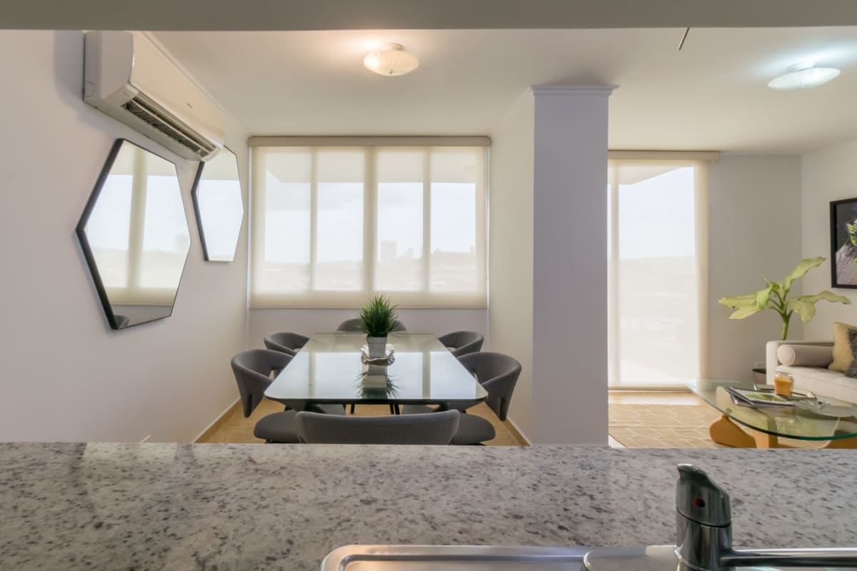 Open-plan living room and dining area at Cosmopolitan Towers Panama