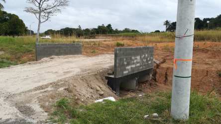 Partially complete bridge on dirt road rural Panama Villas Campestres