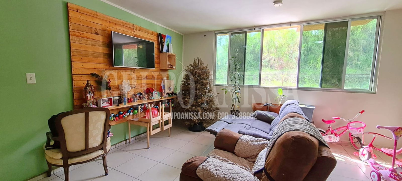 Bright living dining room with large windows sectional sofa and kids bikes PH Mallorca Park Panama