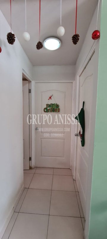 Interior corridor with white walls and holiday decorations PH Mallorca Park Panama