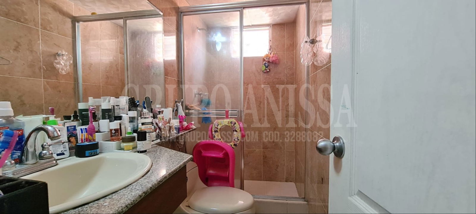 Modern bathroom with granite sink, glass shower, beige tiles in Mallorca Park Panama