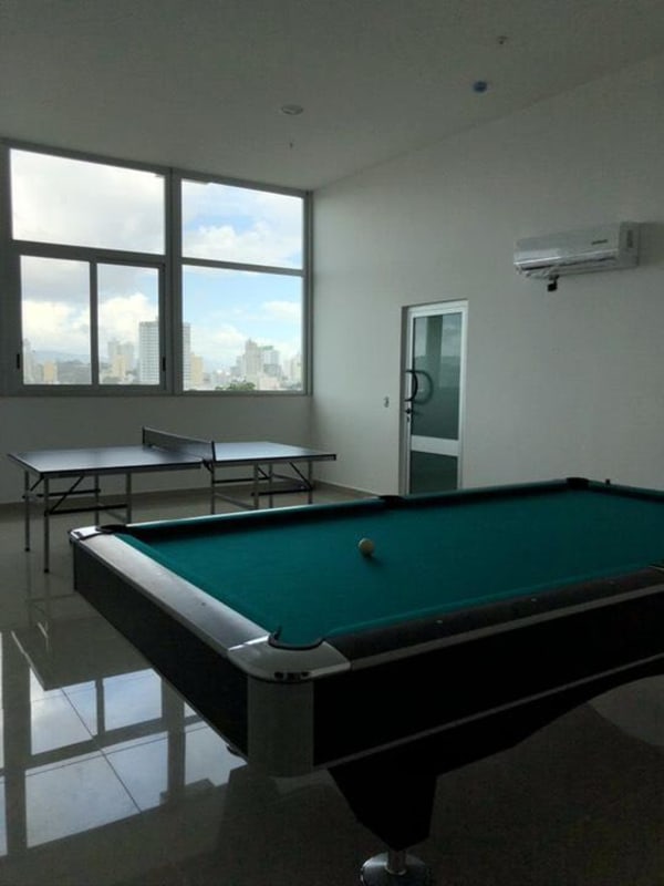 Master bedroom with built-in closet, large window, AC unit, and ensuite bathroom in PH Vista Hermosa Panama