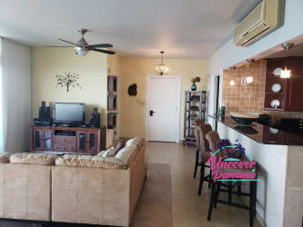 Ocean view master bedroom with en-suite, air conditioning and balcony access in Miramar Farallón condo