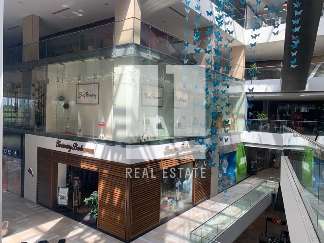 Interior atrium with retail stores inside Costa del Este Atrio Mall Panama City Panama
