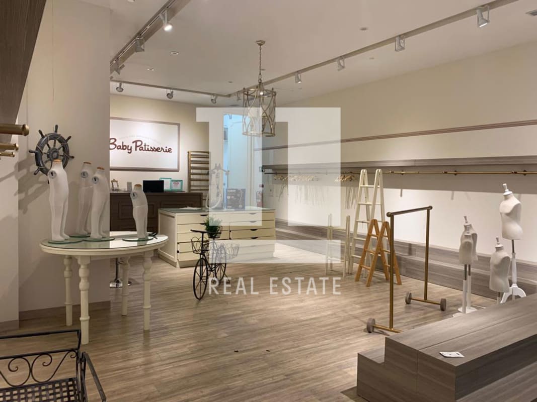 Modern retail shop interior with display racks glass windows in Atrio Mall Costa del Este Panama