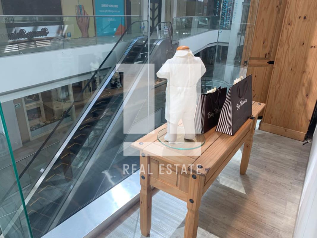 Retail gelass storefront with mannequins large window in Atrio Mall Panama City