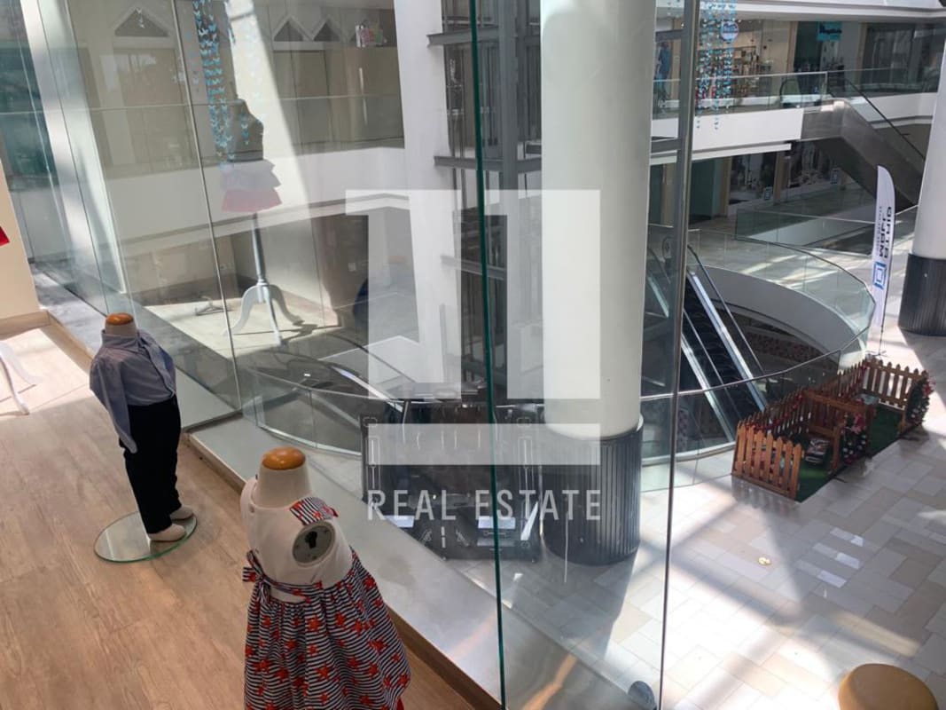 Retail glass storefront inside Atrio Mall Costa del Este Panama City commercial property