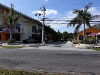 Minimalist bathroom with pedestal sink and toilet in PH Coronado Plaza commercial space Nueva Gorgona Panama