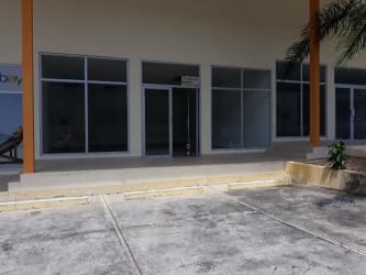 Glass storefront entrance of commercial space PH Coronado Plaza