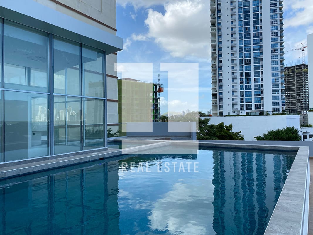 Luxury swimming pool with glass facade and skyline views PH Panorama Tower Panama