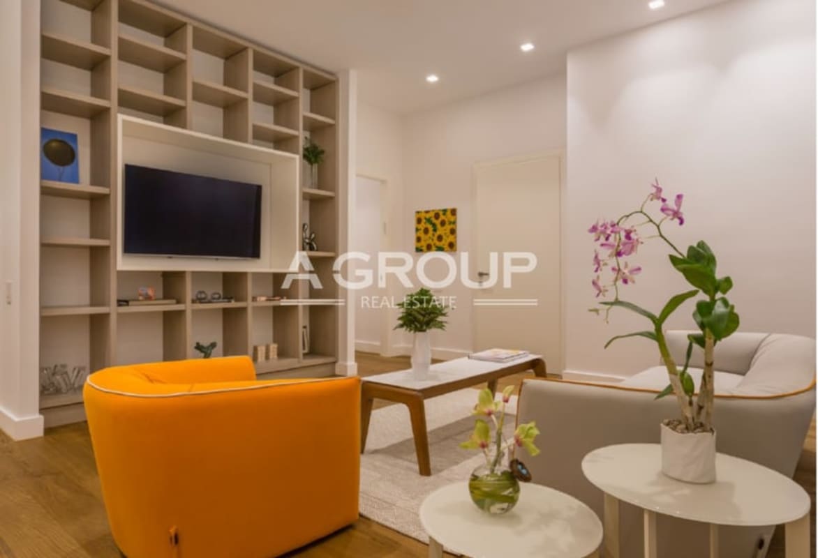 Luxury condo living area wood flooring built-in shelves Ocean Reef Islands Panama