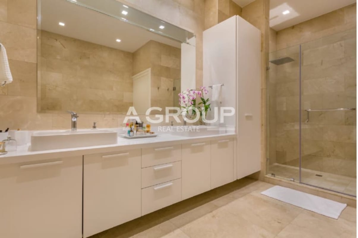 Contemporary bathroom with glass shower white vanity Ocean Reef Islands luxury apartment Panama