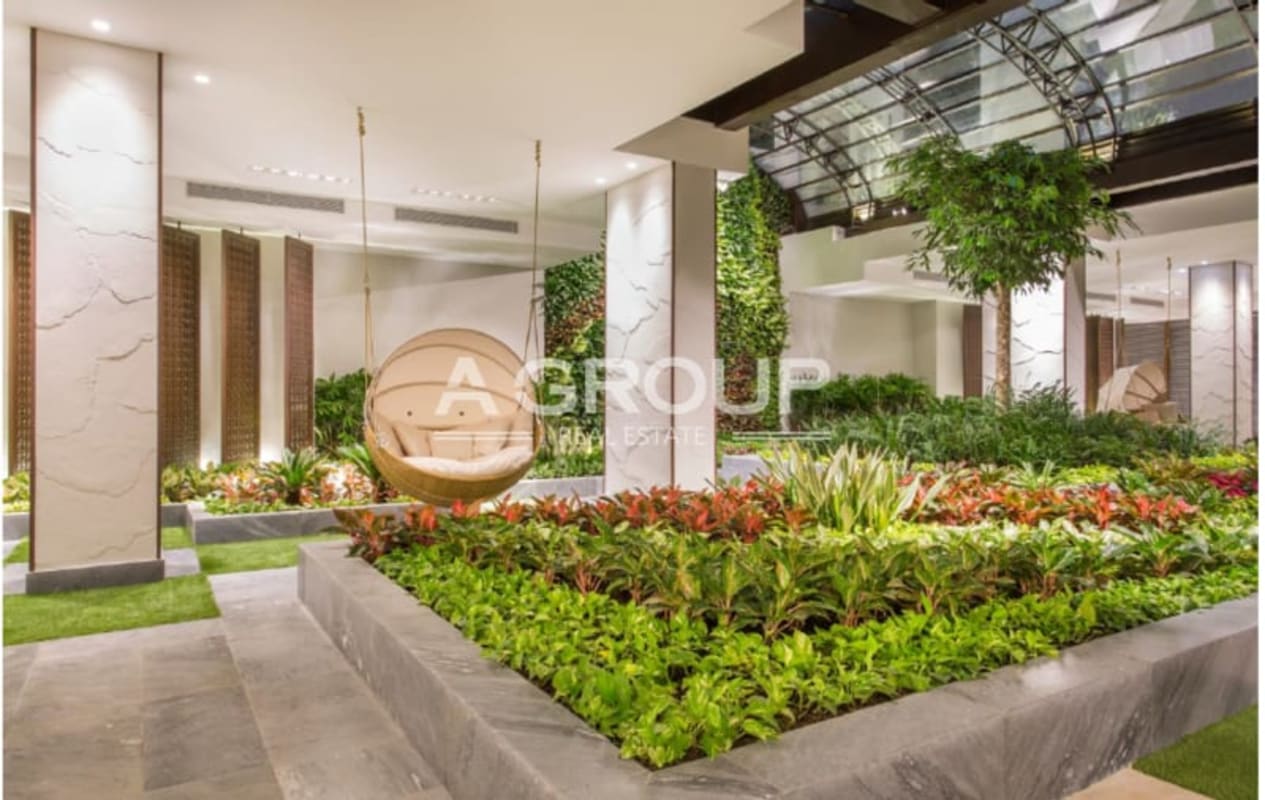 Indoor atrium with swing chair vertical garden marble columns at Ocean Reef Islands