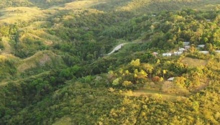 Aerial landscape of lush hills, green forest, and development land in Copecito San Carlos Panama