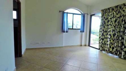 Kitchen with granite countertops, stainless steel appliances, breakfast bar, wood cabinetry in Altos del Maria villa
