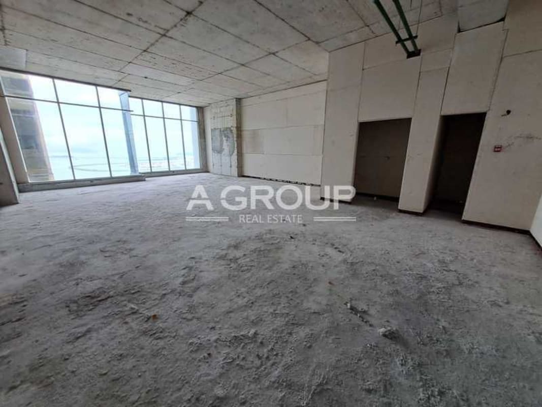 Modern granite and marble elevator lobby with stainless steel elevators at PH BICSA Tower