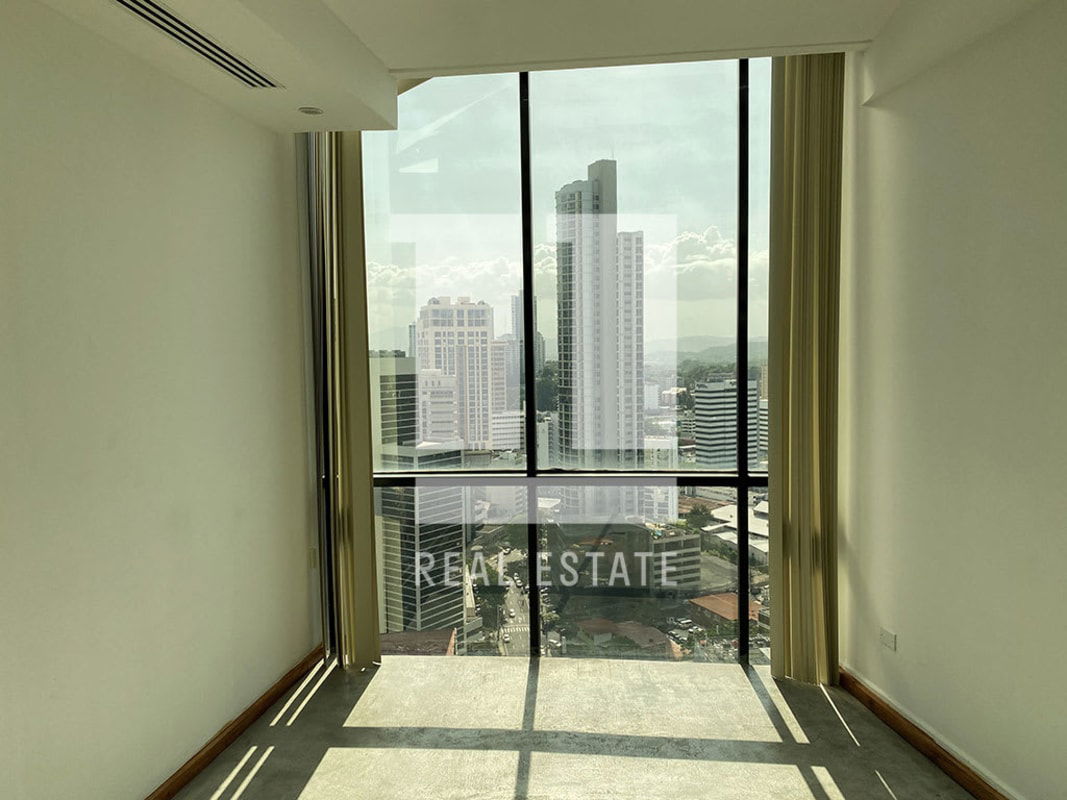 Industrial-style open plan office space with wood accents, exposed ducts PH Torre Generali Obarrio