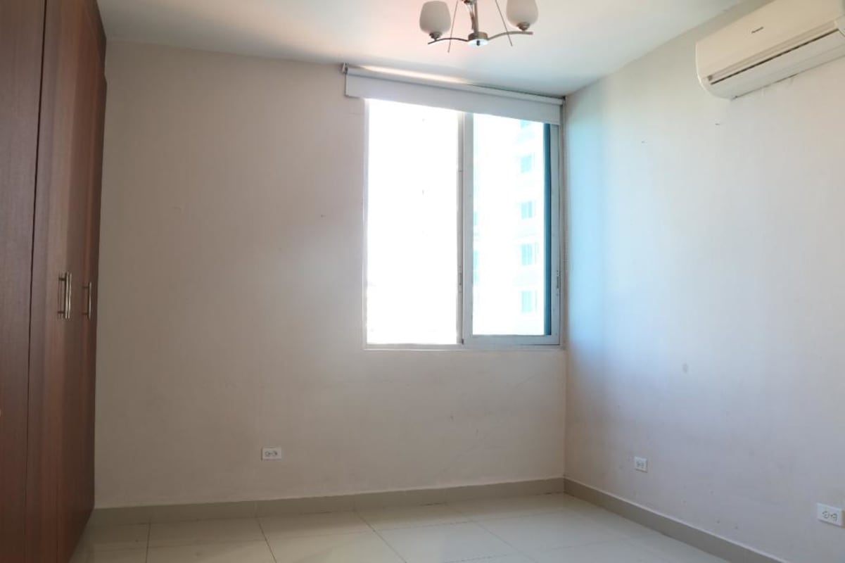 Spacious living area with glass doors to balcony city view PH Cangrejo Bay Panama