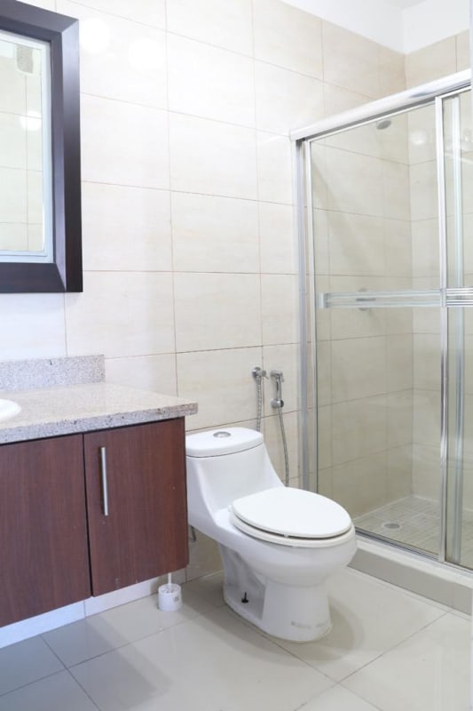 Modern gym with machines and large windows overlooking city PH Cangrejo Bay Panama